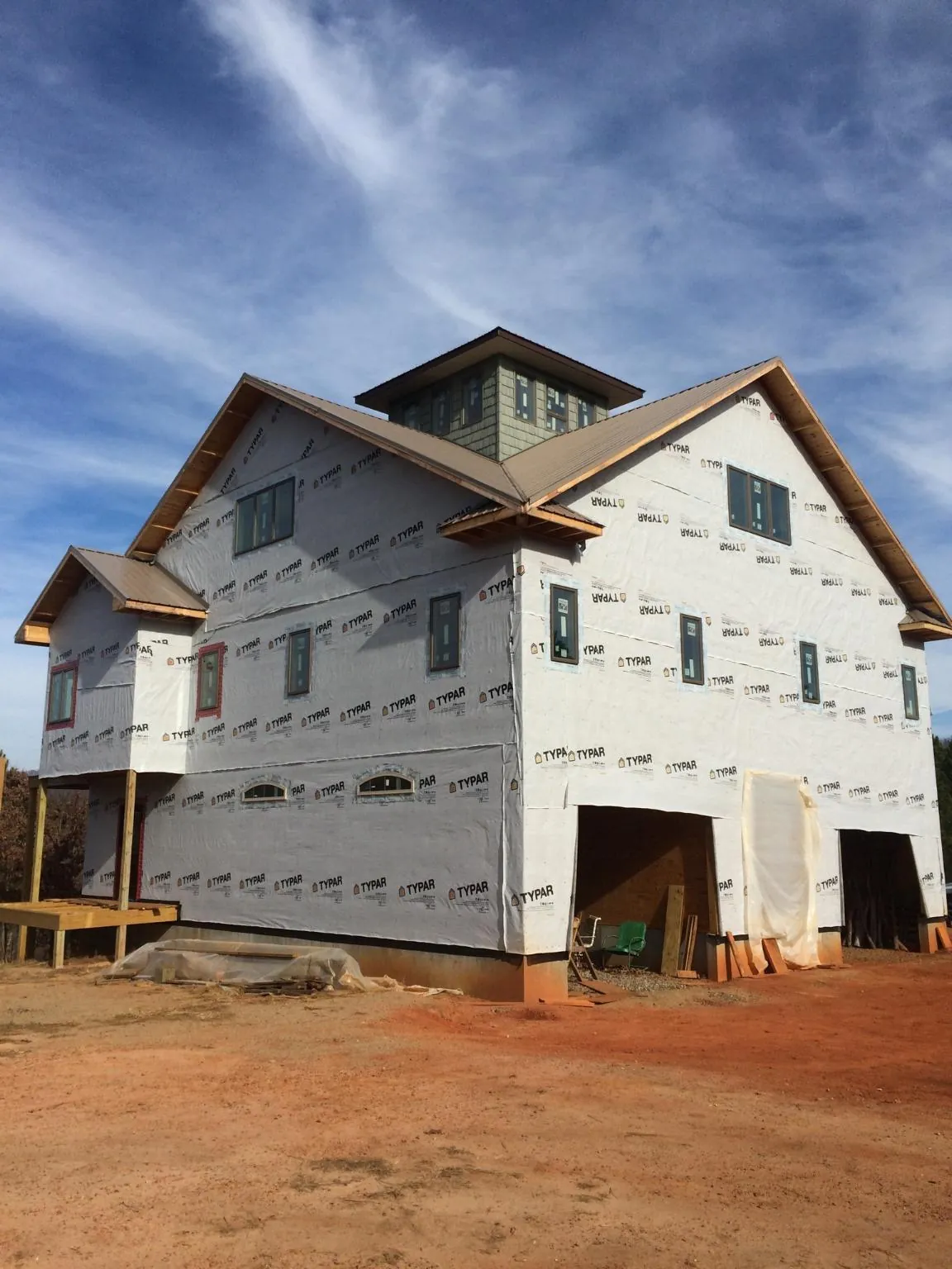 New two story house under construction with a cupola and gabled roofs in Tahoma